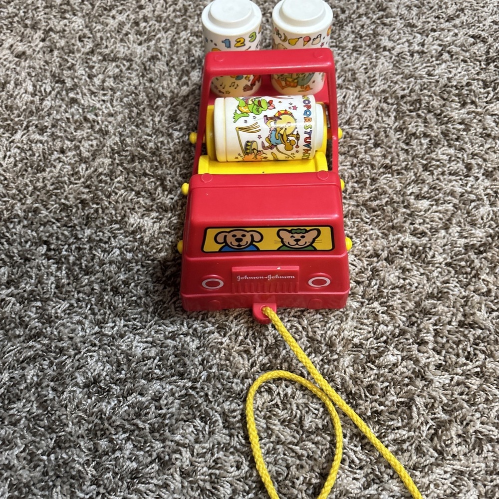 Vintage Johnson & Johnson Rhythm Roller Pull Toy Red Truck 1982